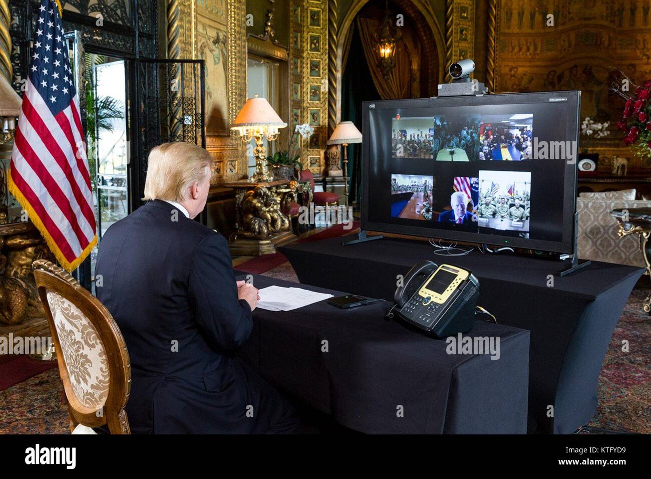 Palm Beach, Florida, USA. 24th December, 2017. U.S. President Donald Trump speaks to service members deployed overseas via an online video to wish them a Merry Christmas from his private resort Mar-a-Lago December 24, 2017 in Palm Beach, Florida. Credit: Planetpix/Alamy Live News Stock Photo
