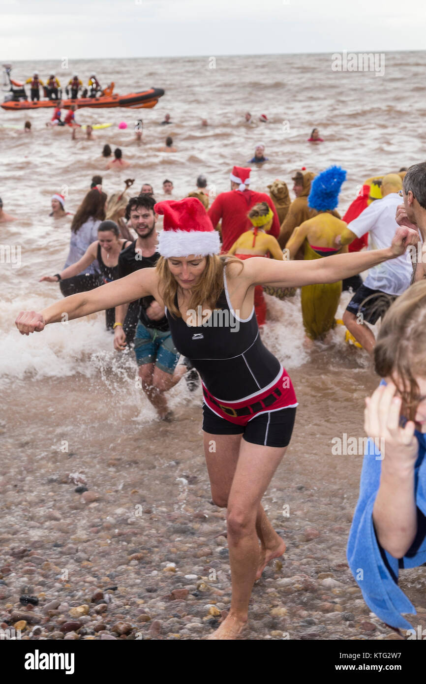 Sidmouth, Devon 26th Dec 17 Having braved the freezing cold sea, crowds struggle back up the Sidmouth, Devon 26th Dec 17 Having braved the freezing cold sea, crowds struggle back up the