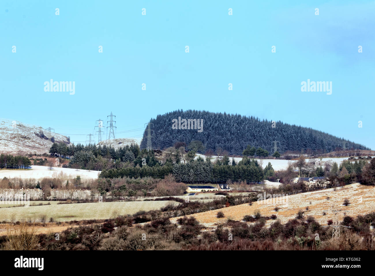 Glasgow, Scotland, UK  26th December.UK Weather: Snow on kilpatrick hills the judges wig feature ,overlooking the city with sunshine and overnight snow. Credit Gerard Ferry/Alamy news Stock Photo