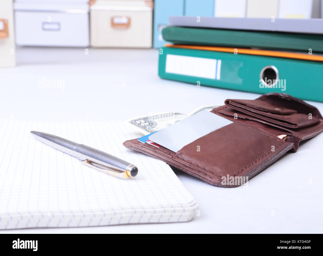 Folder file, note and wallet on the desk. blurred background Stock ...