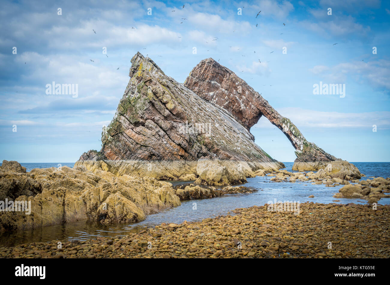 Bow Fiddle Rock, natural sea arch near Portknockie on the north-eastern coast of Scotland. Stock Photo