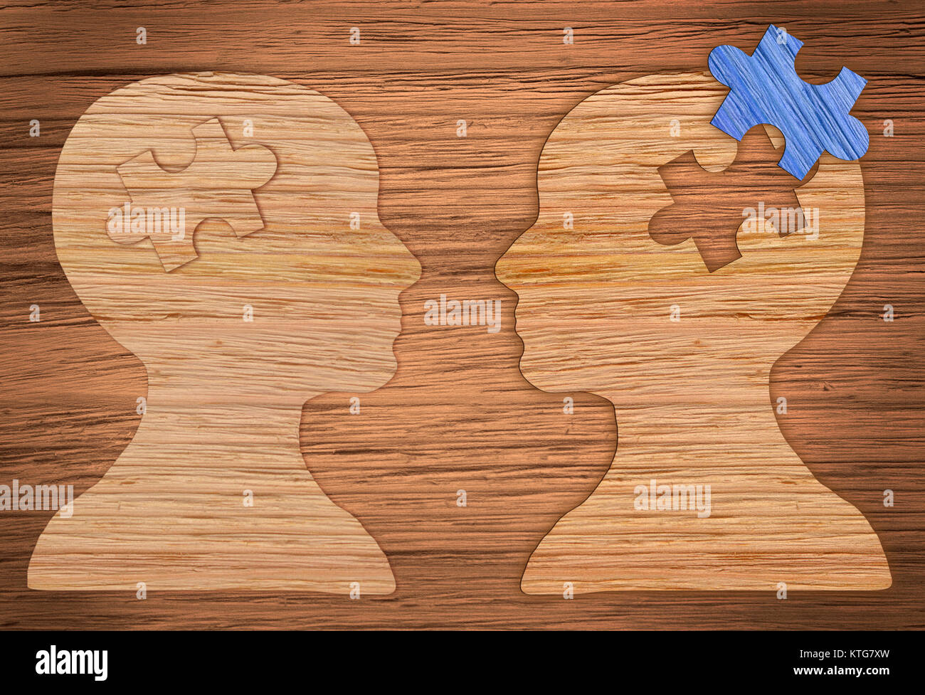 Puzzle head brain concept. Human head profile made from brown paper with a jigsaw piece cut out. Stock Photo