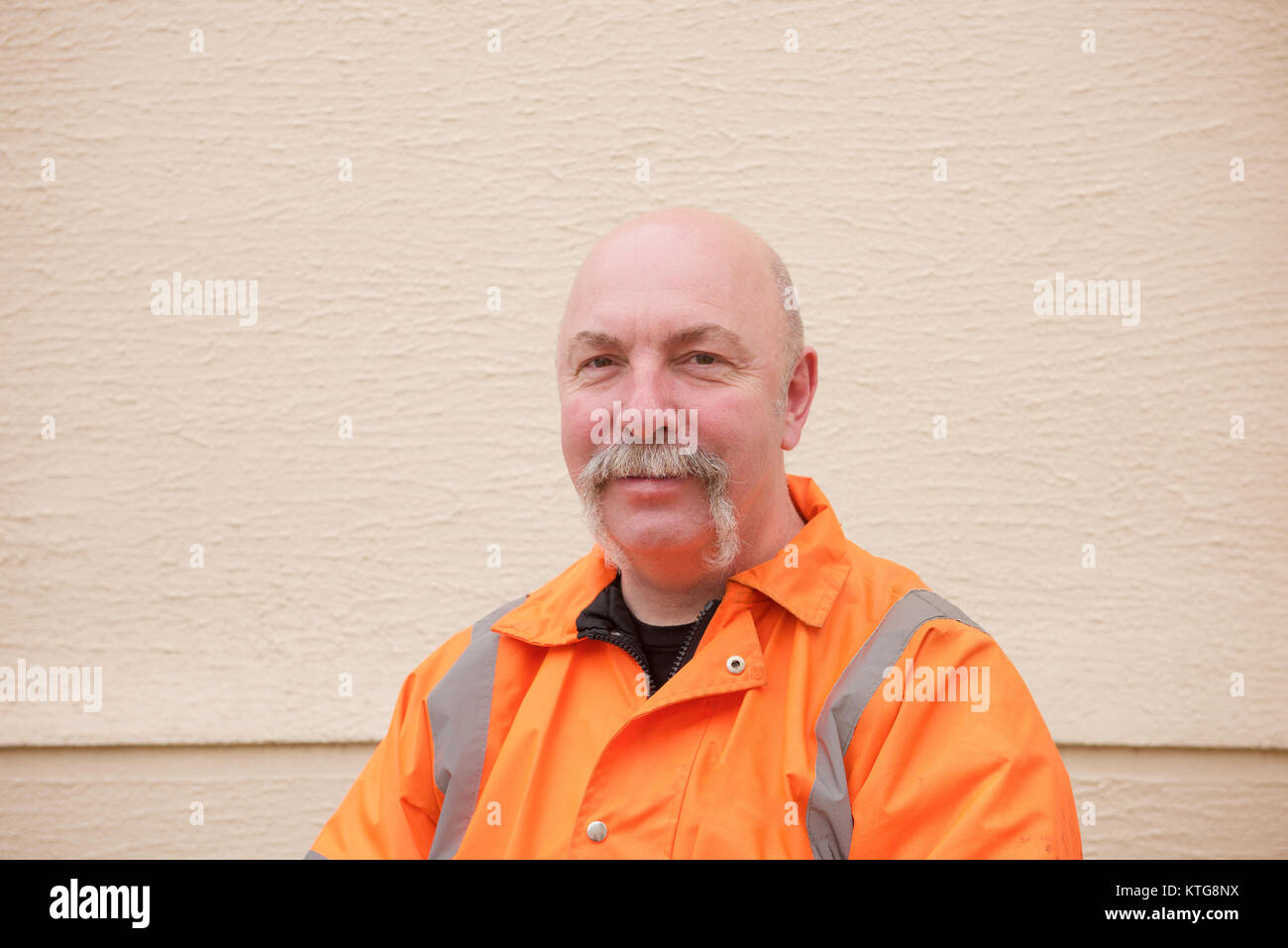 Workman in a highvisibility jacket head and shoulders Stock Photo