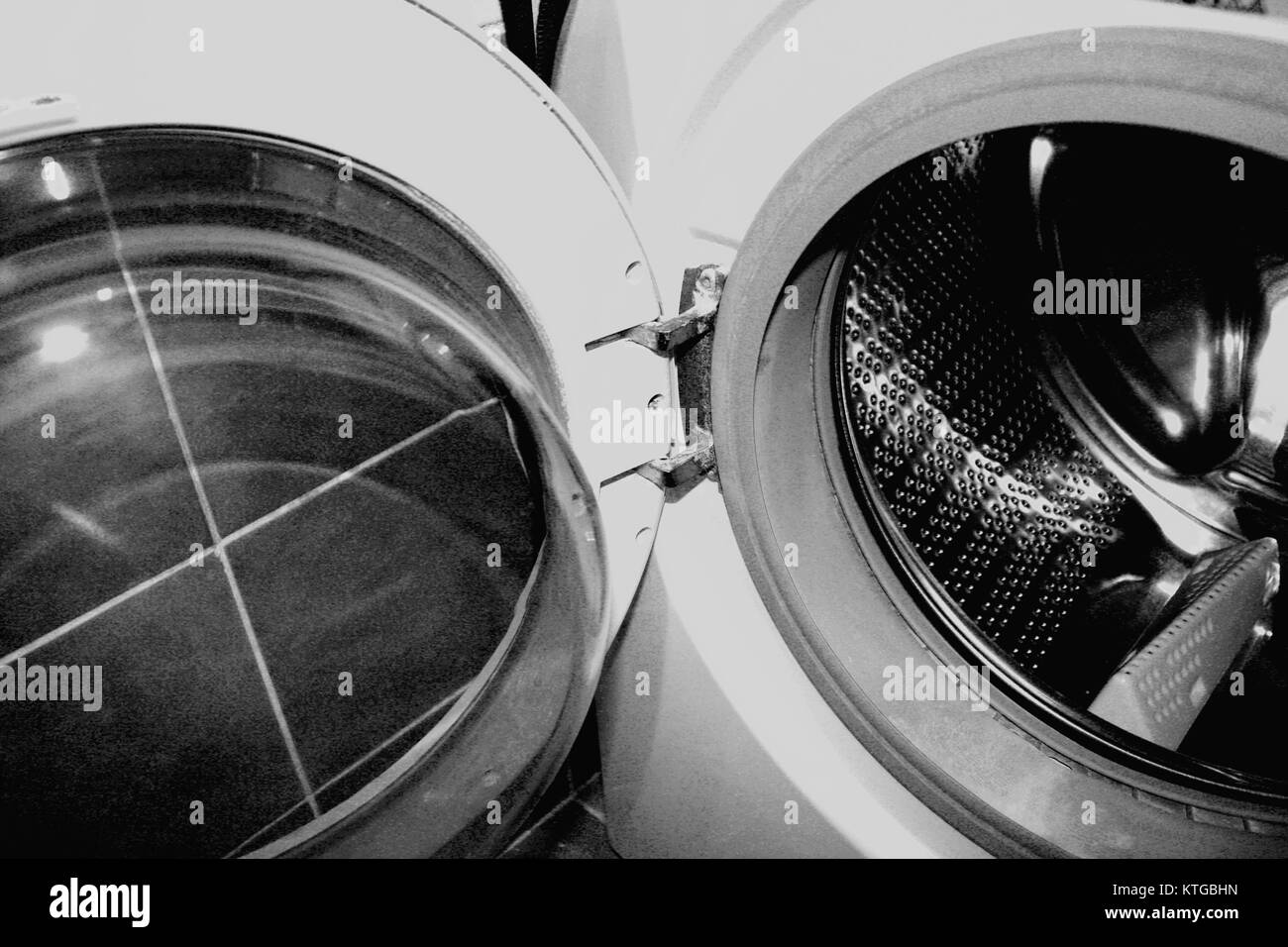 Woman using washing machine Black and White Stock Photos & Images Alamy