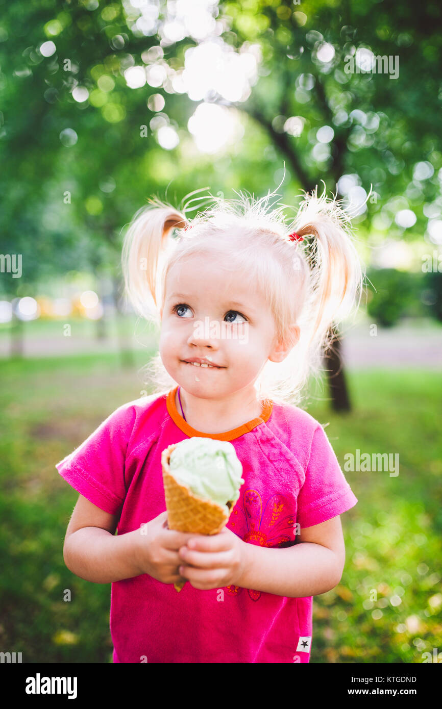 Girl eating melted ice cream hi-res stock photography and images - Alamy