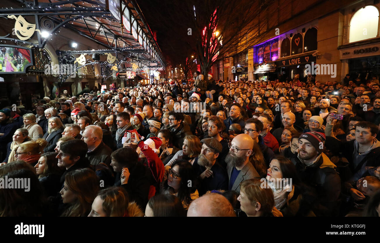 Thousands watch the annual Christmas Eve busk in aid of the Dublin