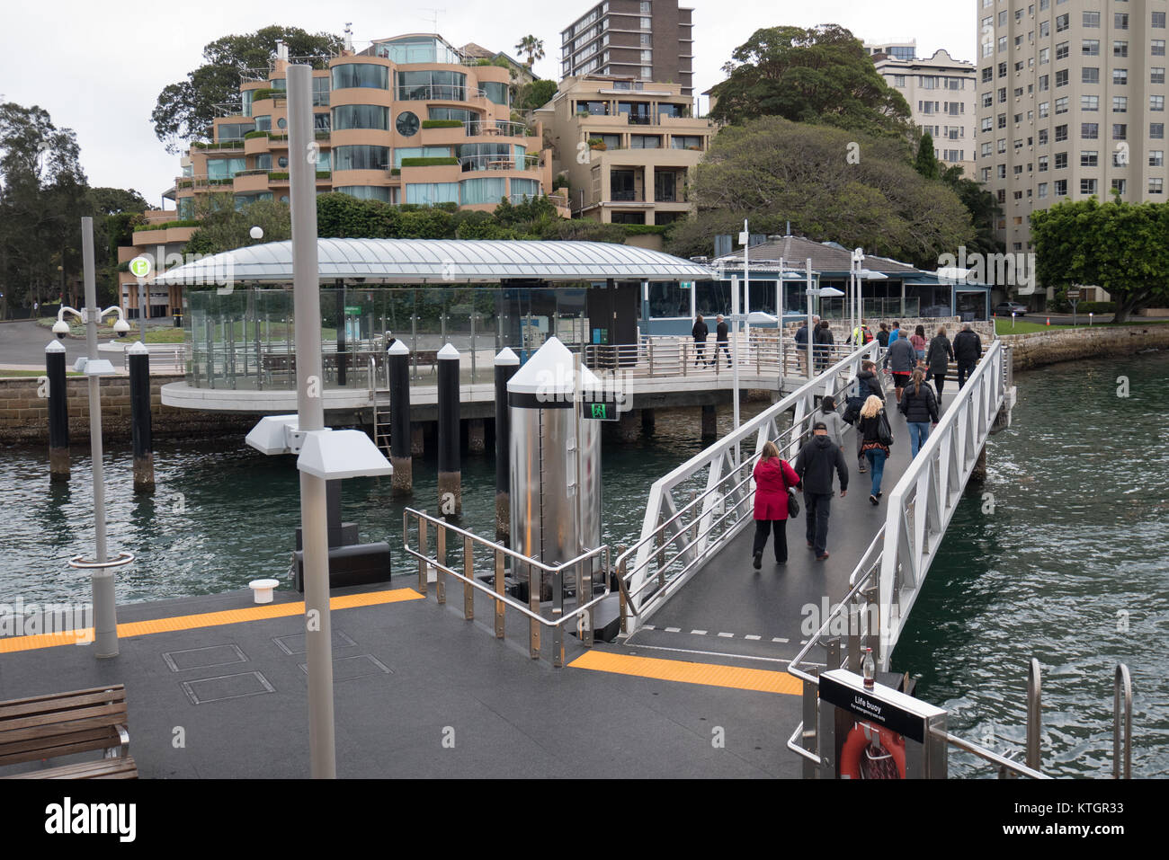 Passengers leaving ferry dock Stock Photo