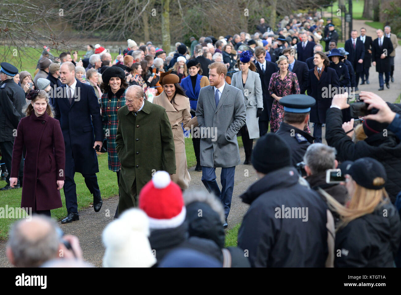 (Left-right front) Lady Louise Windsor, the Duke of Edinburgh, (left-right centre) The Duke and Duchess of Cambridge, Meghan Markle and Prince Harry arriving to attend the Christmas Day morning church service at St Mary Magdalene Church in Sandringham, Norfolk. Stock Photo