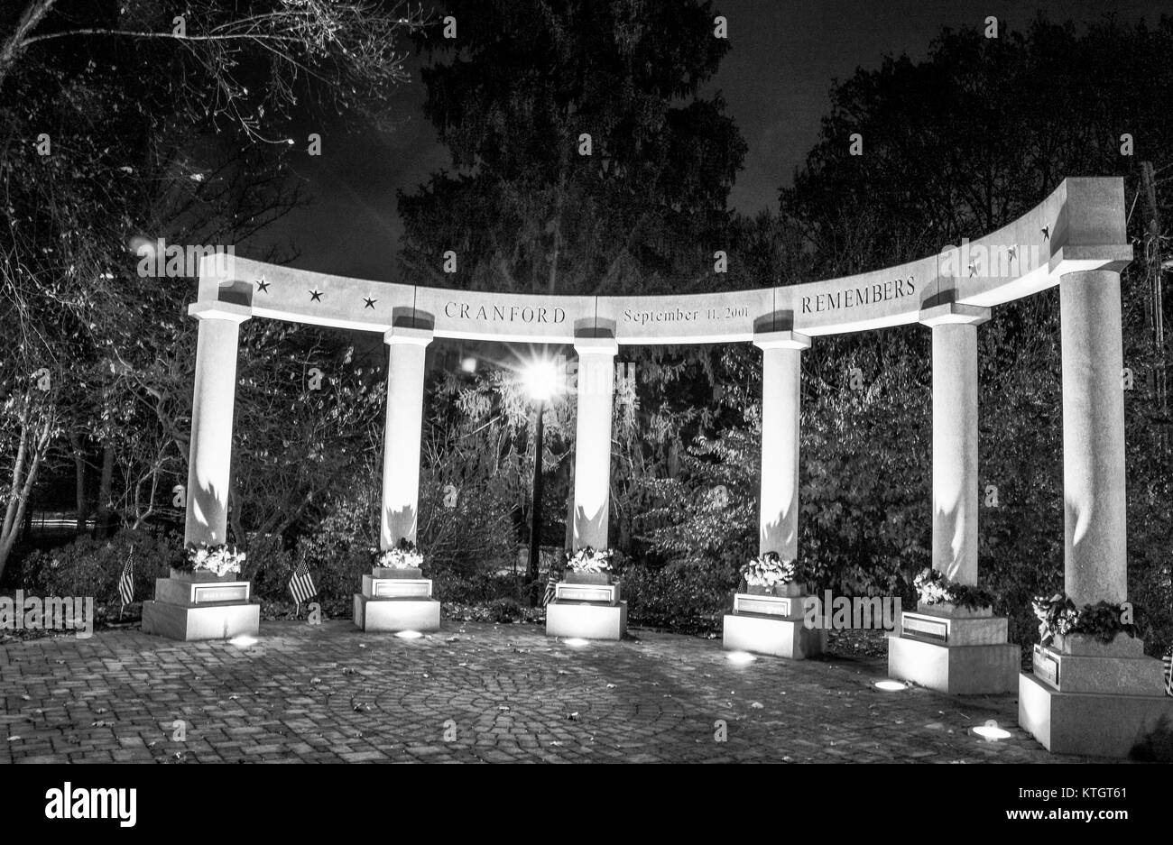 Exterior nighttime black and white stock photo of memorial commemorating September 11 attacks in Cranford New Jersey in Union County Stock Photo
