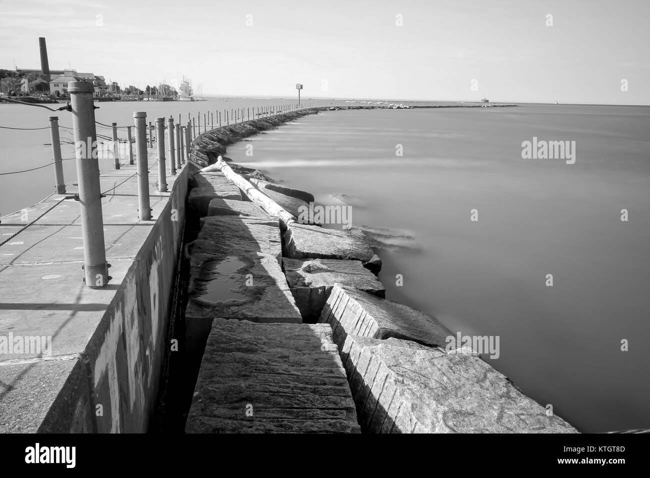 Black and white long exposure concrete trail on Bird Island Pier in Niagara River adjacent to Lake Erie in Buffalo, New York in Erie County Stock Photo