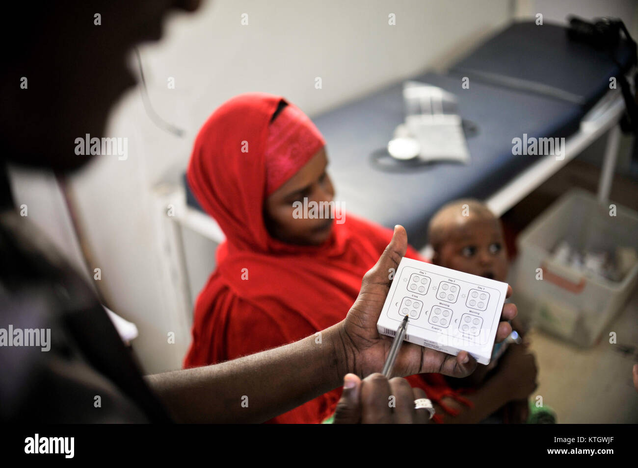 At a clinic held at Jazeera Training Camp on April 6, patients come to a free medical clinic in order to receive treatment for a variety of maladies. Many of the clinic's patients come from Jazeera (8634135908) Stock Photo