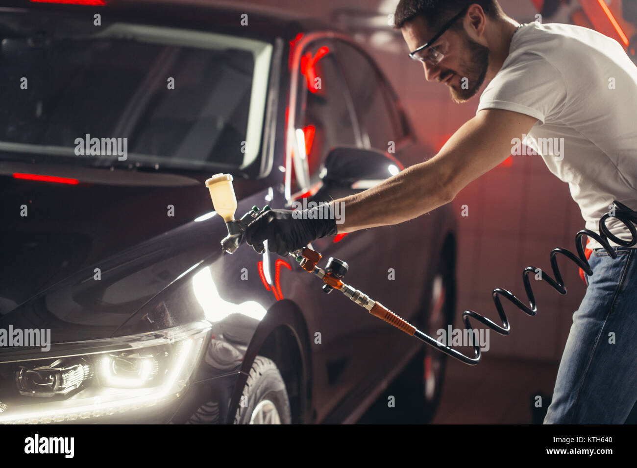 Car wash and coating business with ceramic coating.Spraying varnish to