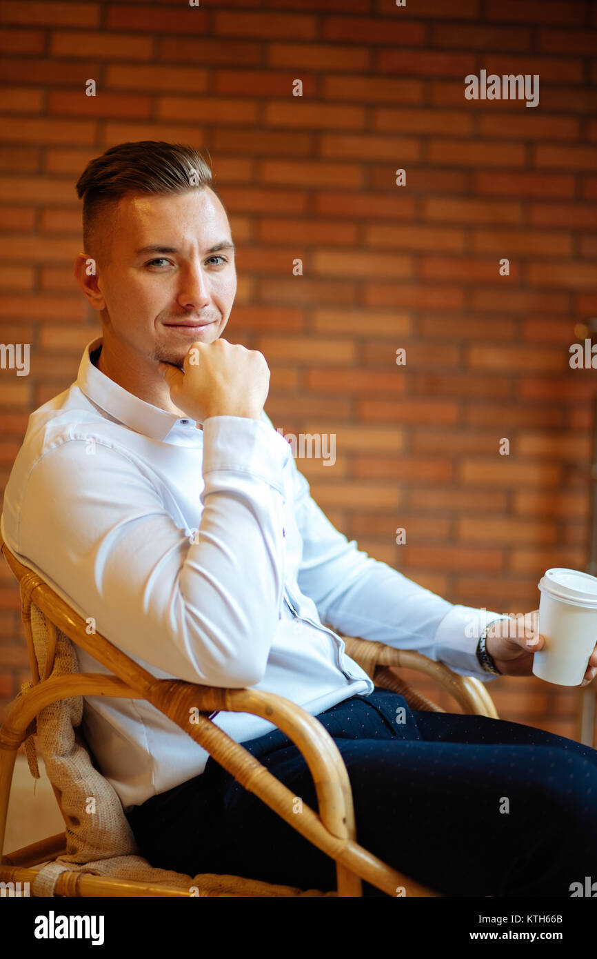 handsome businessman drinking coffee in home and looking camera Stock ...