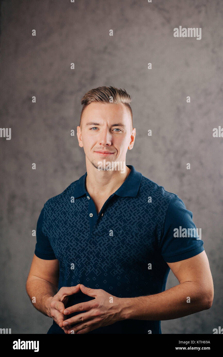 man leaning against a concrete wall and thinking Stock Photo - Alamy