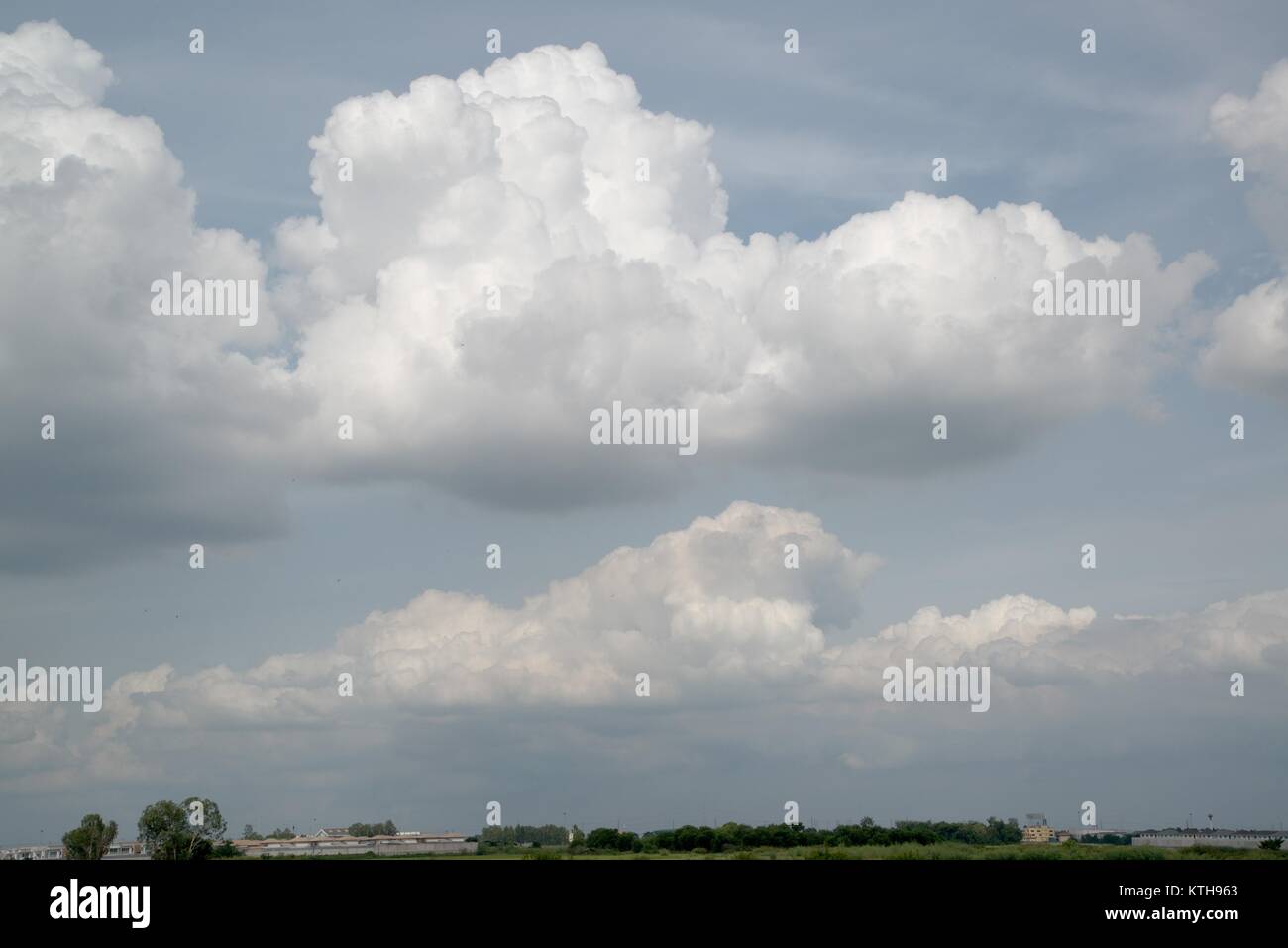 Blue sky background with fluffy clouds in the sky Stock Photo - Alamy