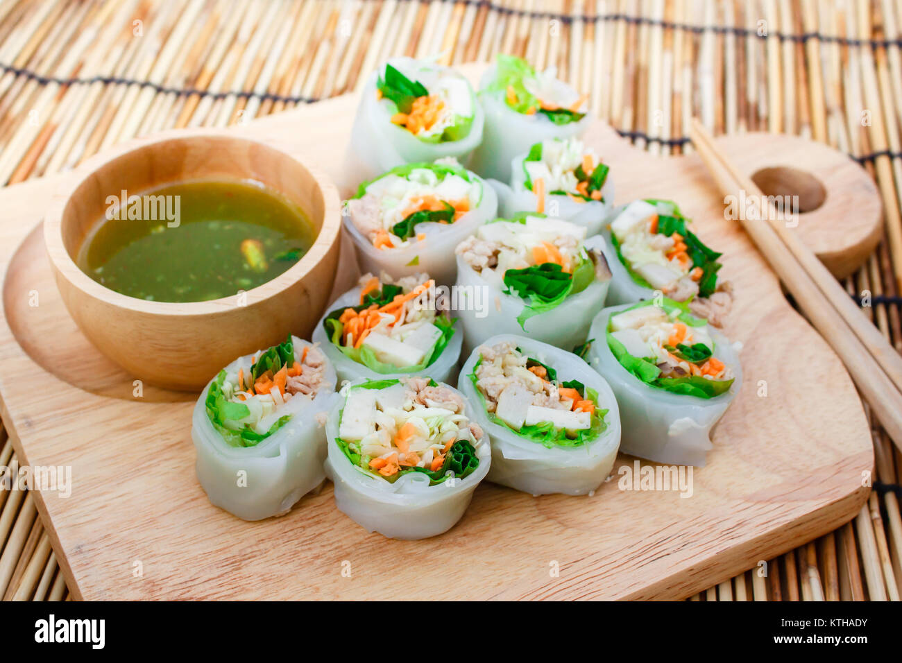 Fresh vegetable noodle spring roll with spicy sauce, thai style. Stock Photo