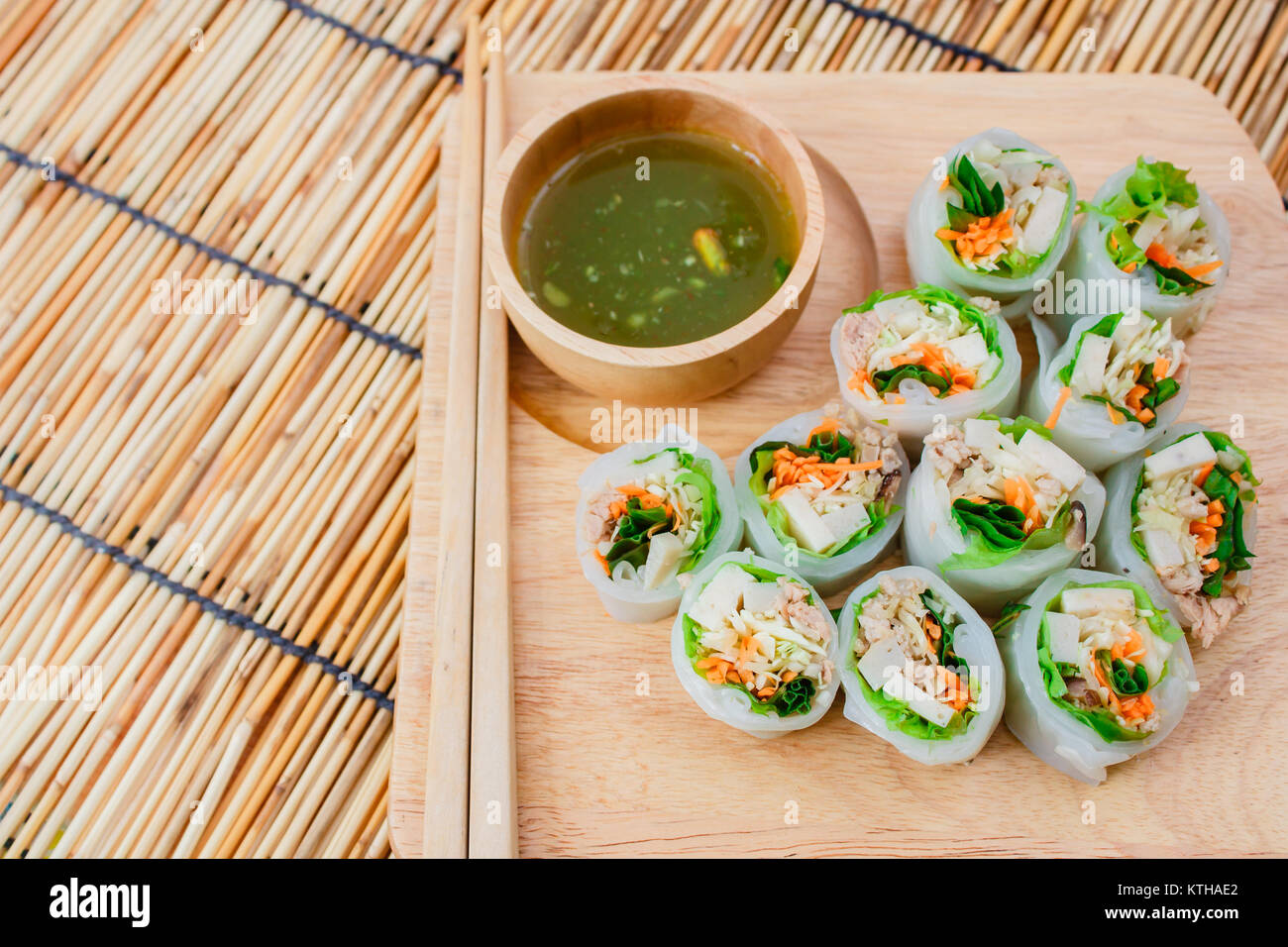 Fresh vegetable noodle spring roll with spicy sauce, thai style. Stock Photo