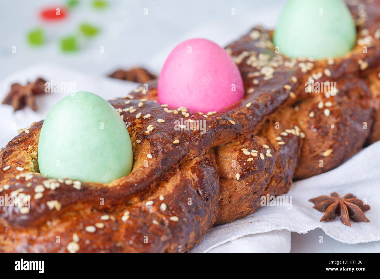 Traditional Greek Easter bread tsoureki in Easter decorations with