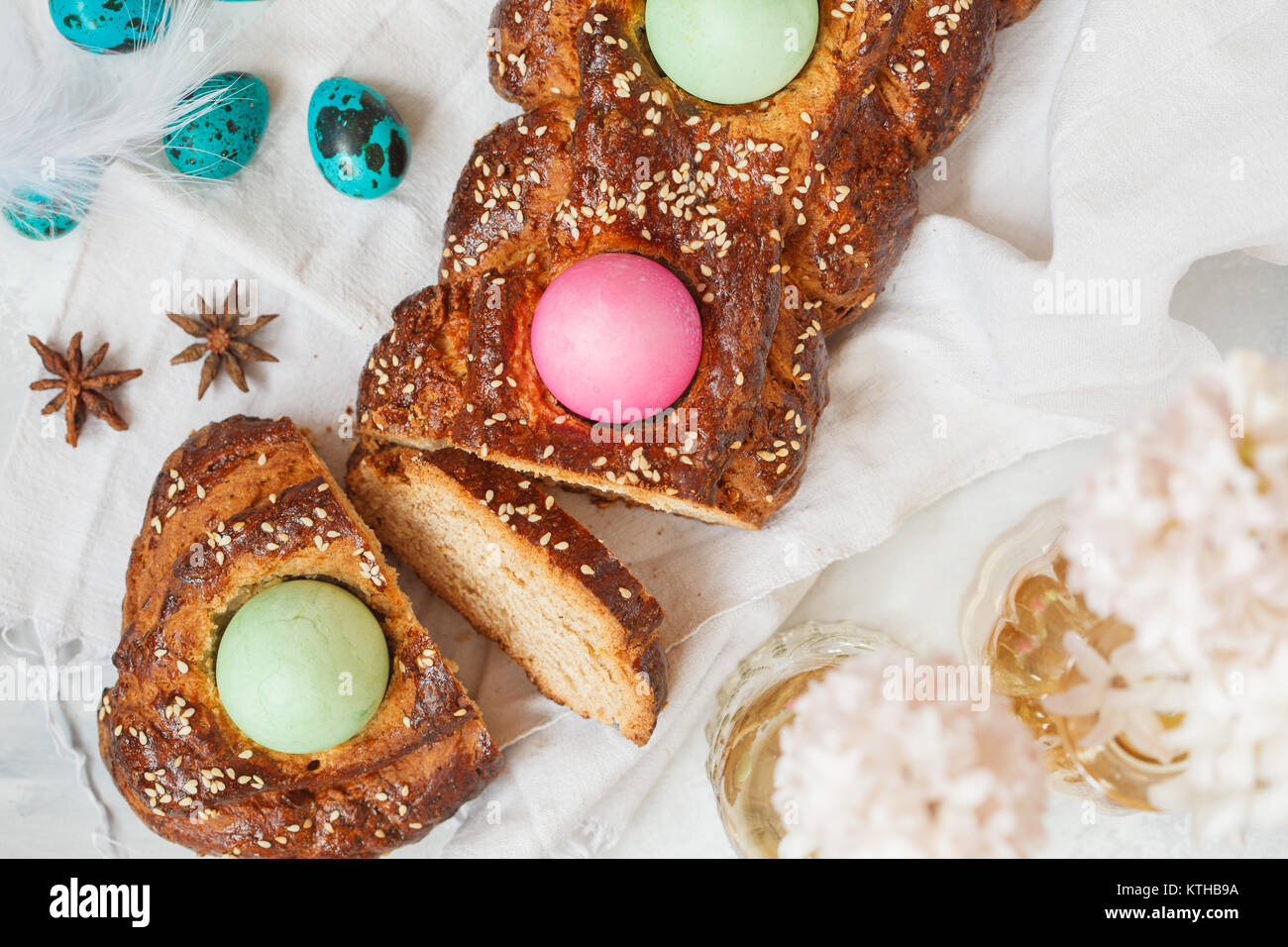 Traditional Greek Easter bread tsoureki, sliced in Easter decoration