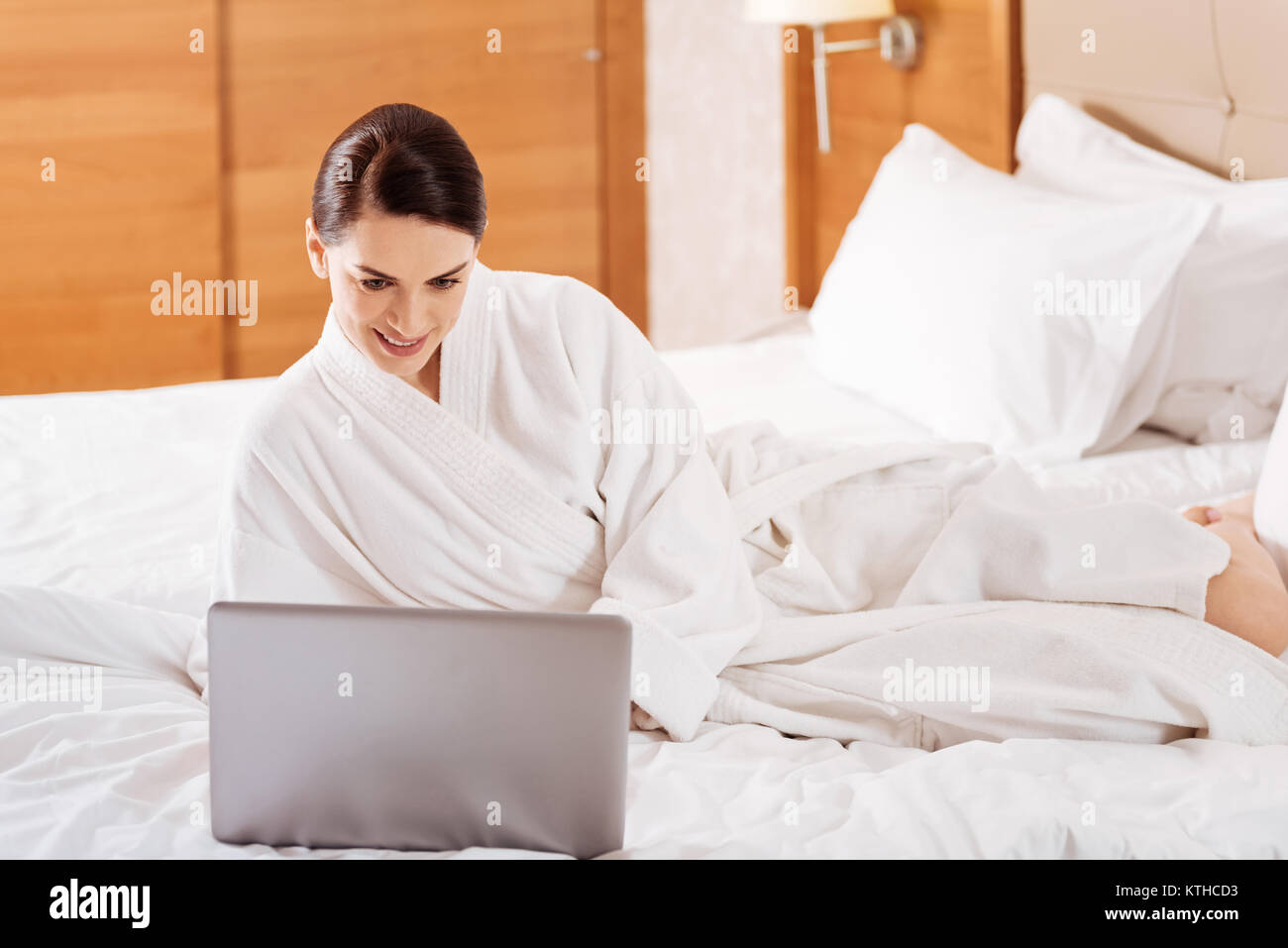 Brunette pleasant woman  checking mails Stock Photo