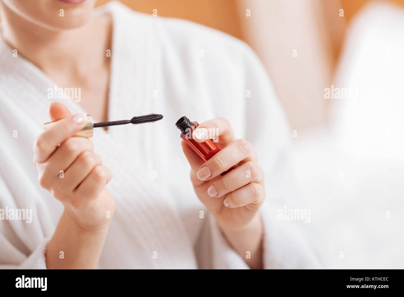 Attractive female hands holding mascara  Stock Photo