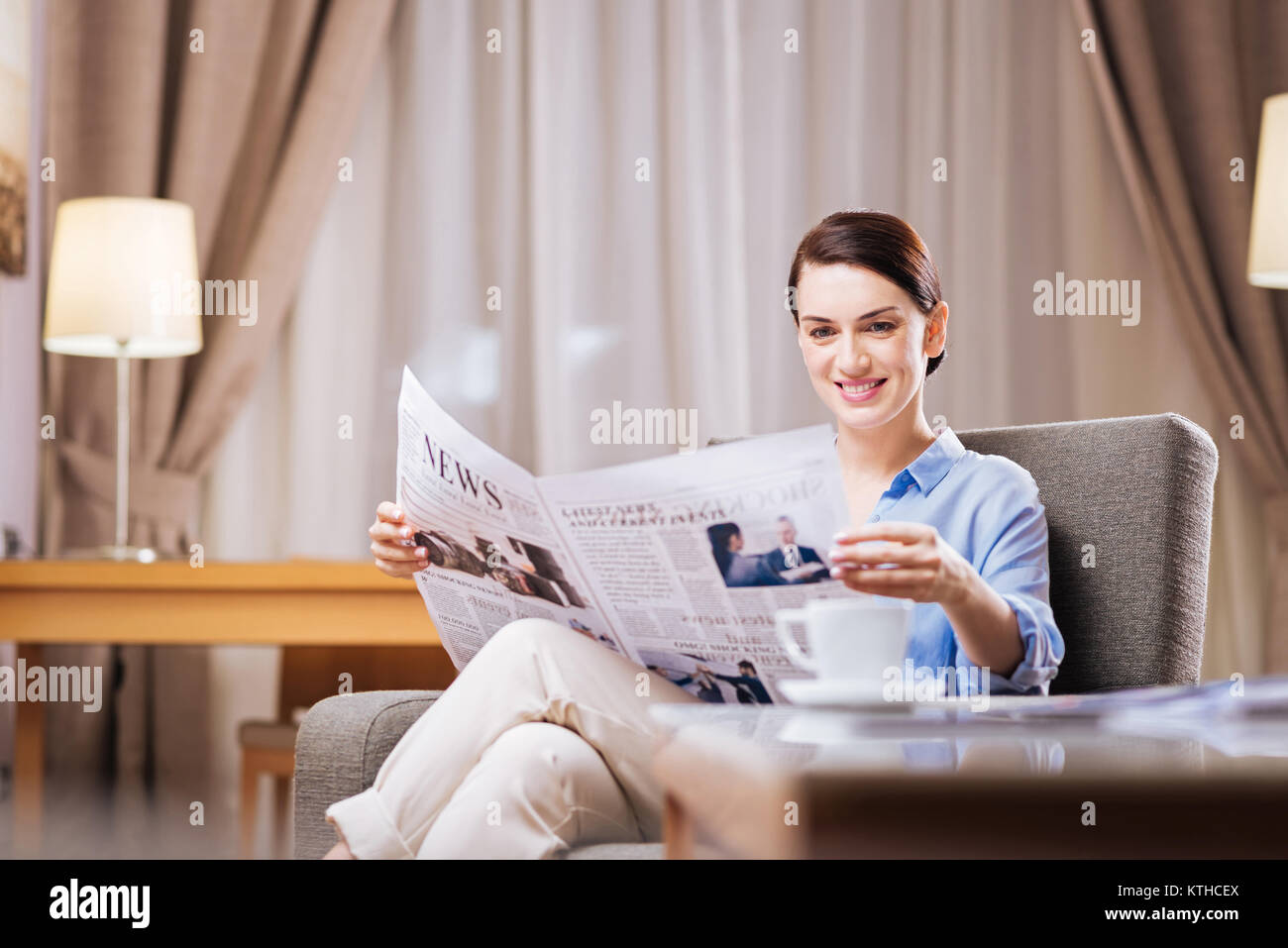 Good looking gorgeous woman evaluating news Stock Photo