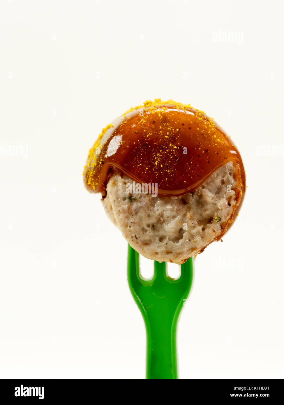 isolated; fork; ketchup; meat; sausage; food; sauce; curry; currywurst; bude; eat; cut; fast; greasy; german; bratwurst; spice; shop; specialty; unhea Stock Photo