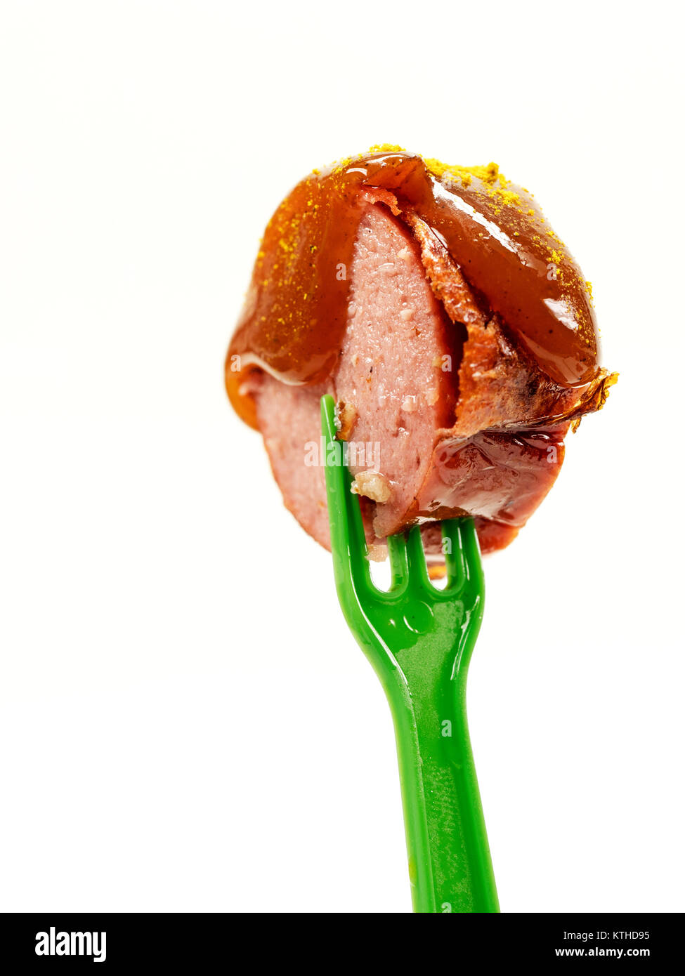 isolated; fork; ketchup; meat; sausage; food; sauce; curry; currywurst; bude; eat; cut; fast; greasy; german; bratwurst; spice; shop; specialty; unhea Stock Photo