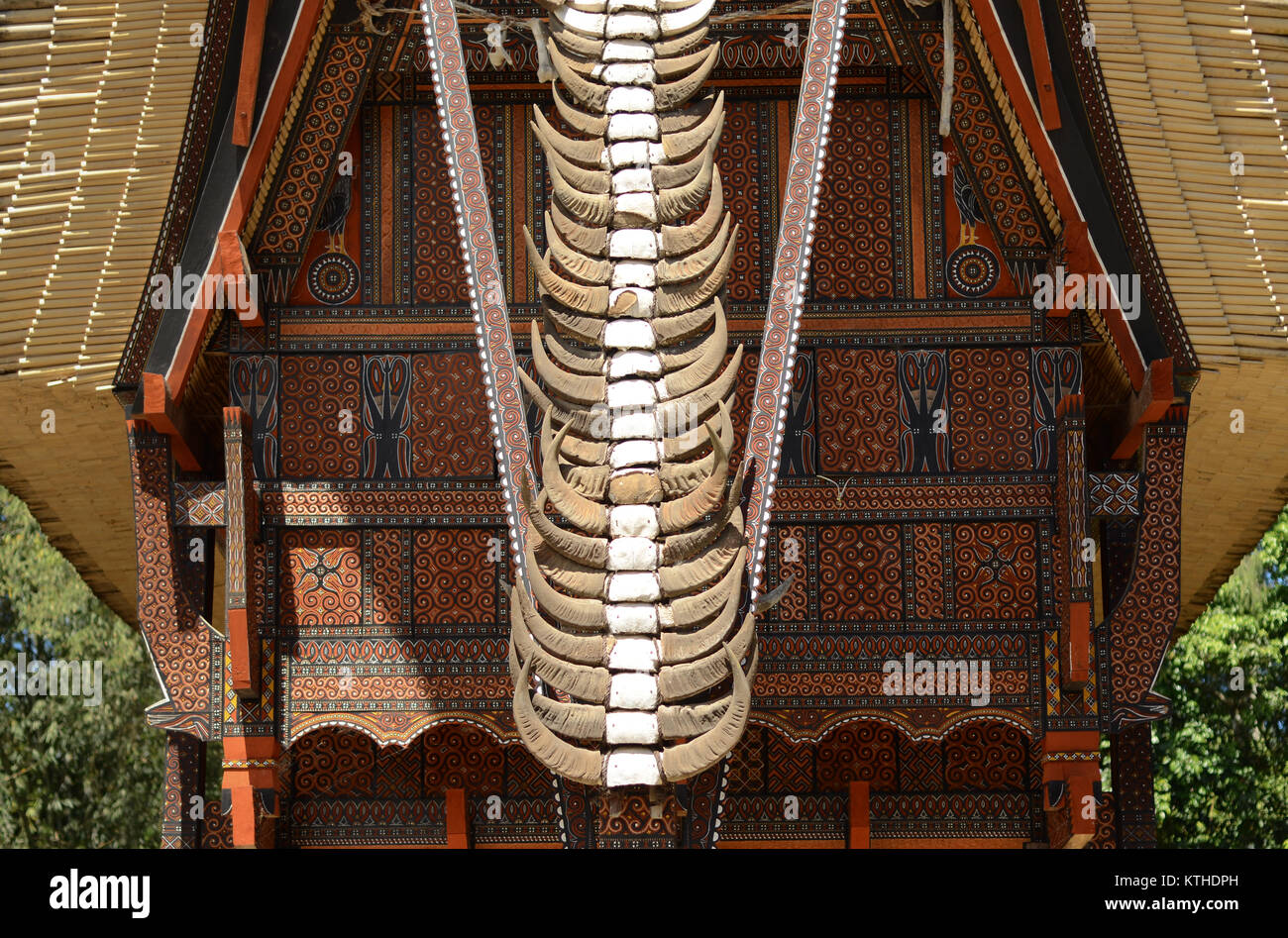 Tongkonan house with buffalo horn stacked as decoration in Tana Toraja in South Sulawesi - Indonesia. The more horn stacked, the higher social status. Stock Photo