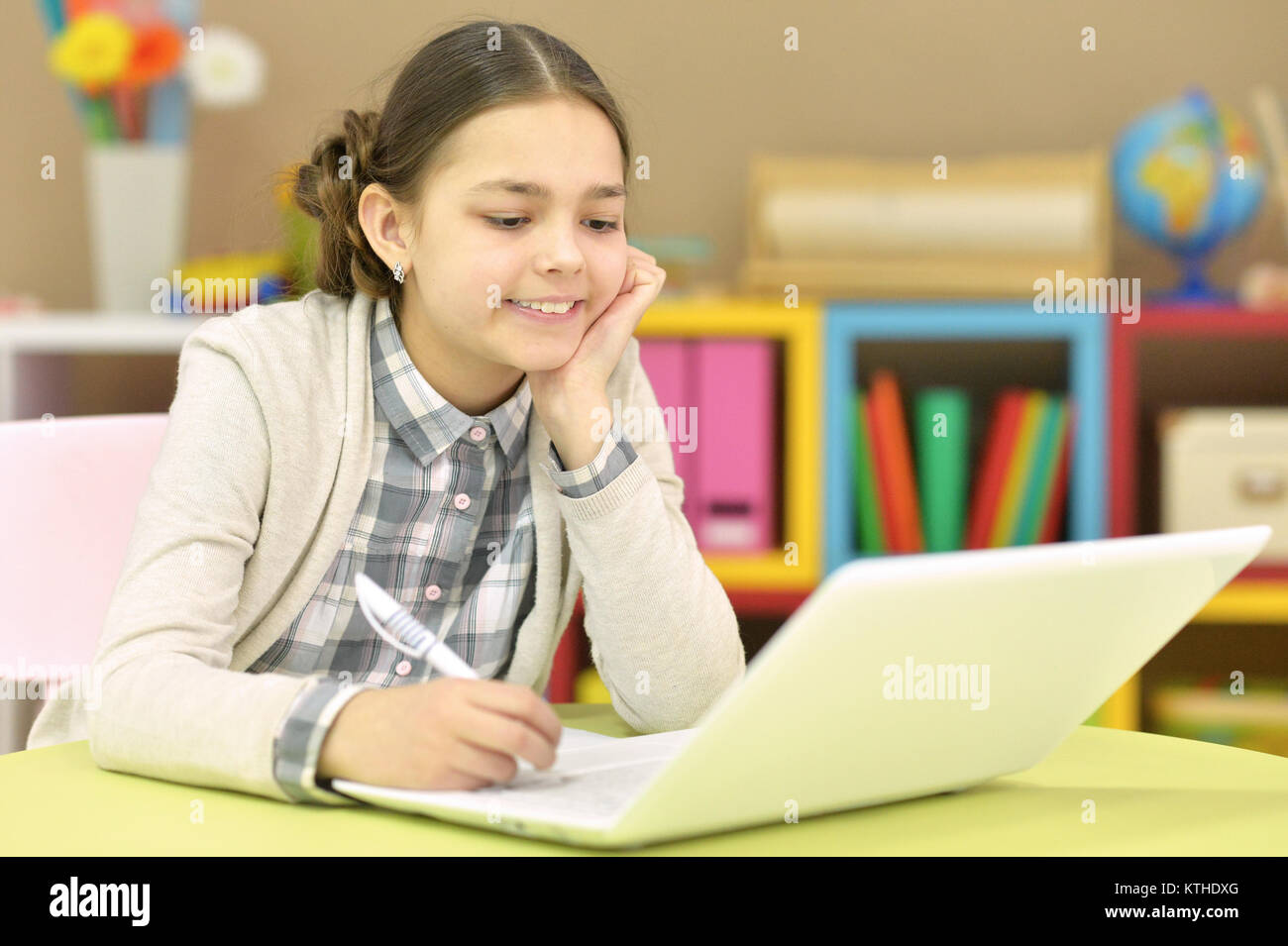 Portrait of a teenage girl using a laptop Stock Photo - Alamy