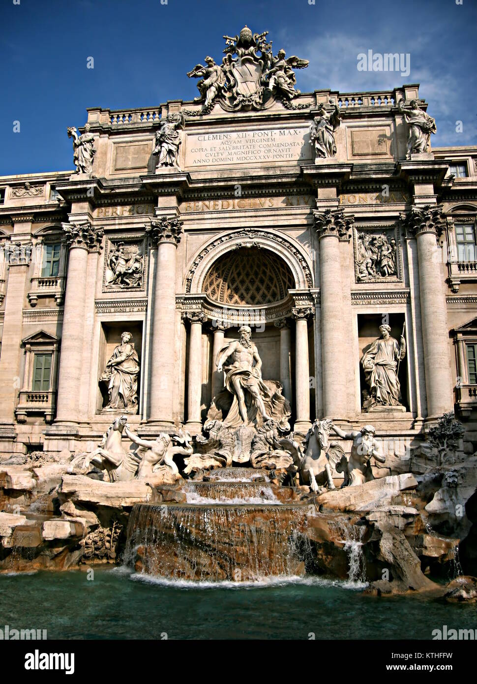 Detail of Trevi fountain, with the statue of Oceanus, two Tritons leading the horses that pulled his chariot and the papal coat of arms on the top. Stock Photo