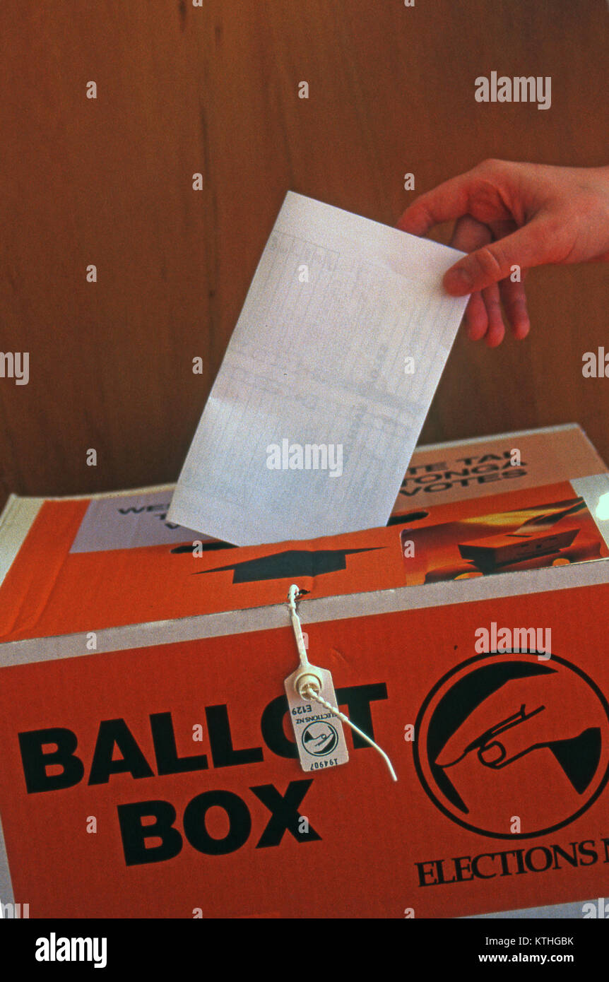 Casting a vote in a New Zealand ballot box for the national election Stock Photo