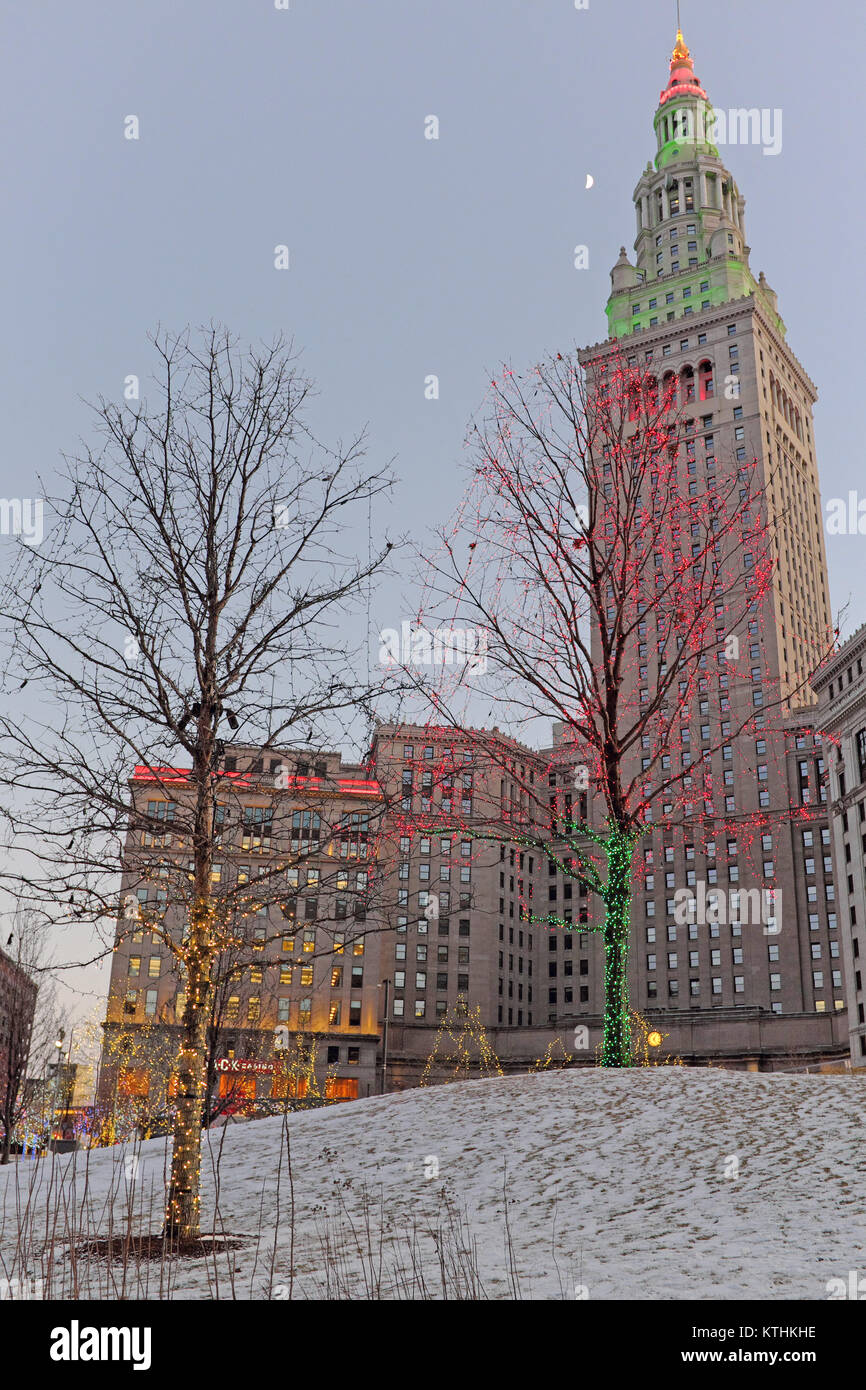 A festive atmosphere on Christmas Day 2017 is enhanced by the colored lights of public square and the iconic Tower City Center behind it. Stock Photo