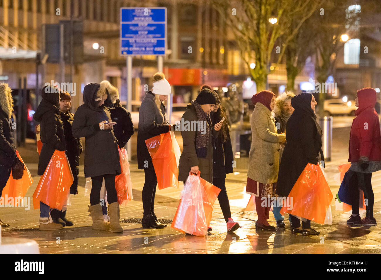 Shoppers at the Next Boxing Day sale at the Next store on Queen Street in Cardiff, Wales. Shoppers queued from 1am for the sale with the store opening its doors to customers at 6am this morning. Stock Photo