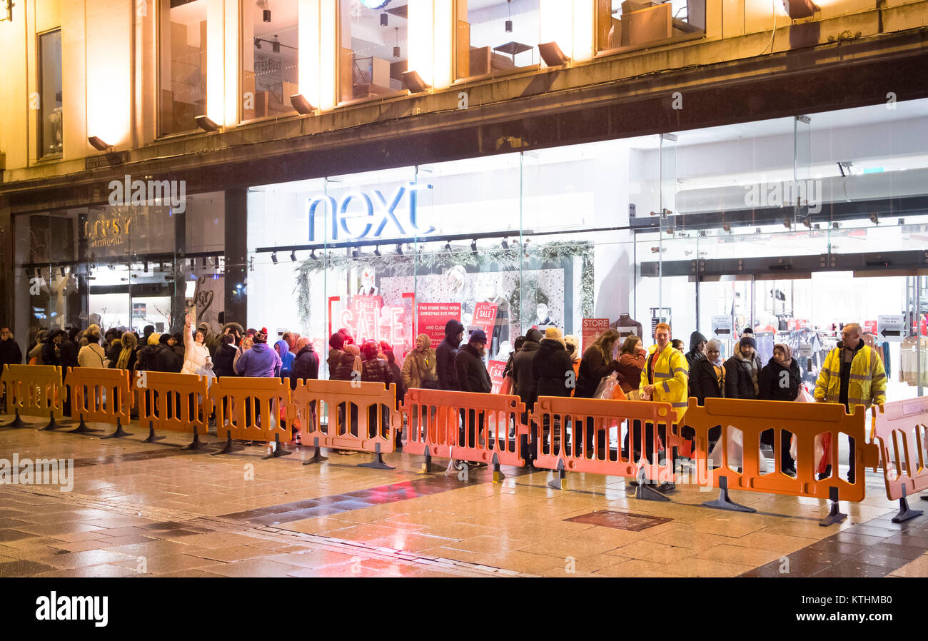 Shoppers at the Next Boxing Day sale at the Next store on Queen Street in Cardiff, Wales. Shoppers queued from 1am for the sale with the store opening its doors to customers at 6am this morning. Stock Photo