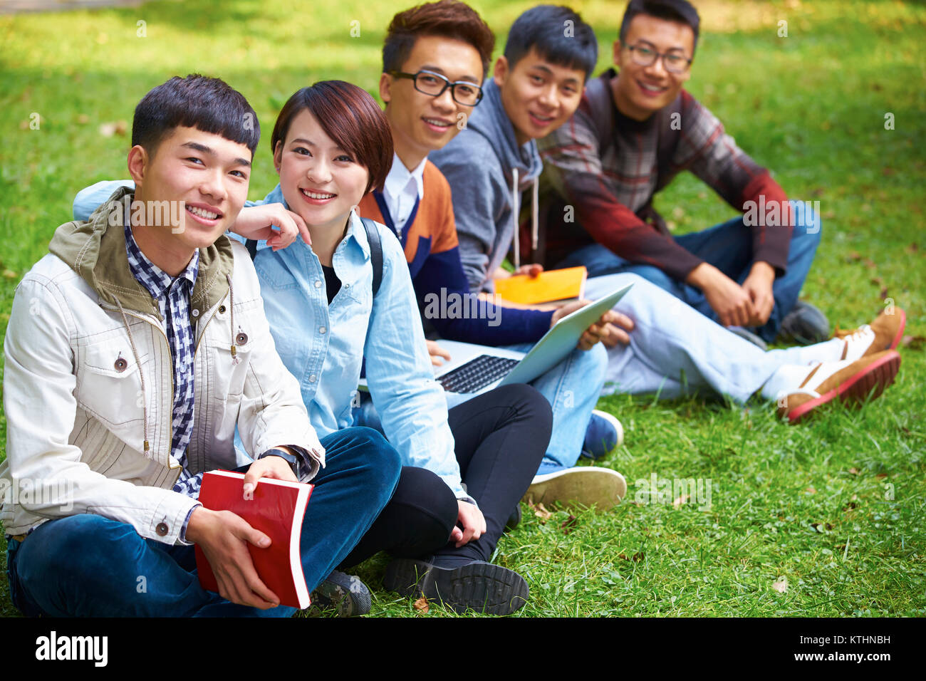 group of happy asian college students looking at camera smile in the ...