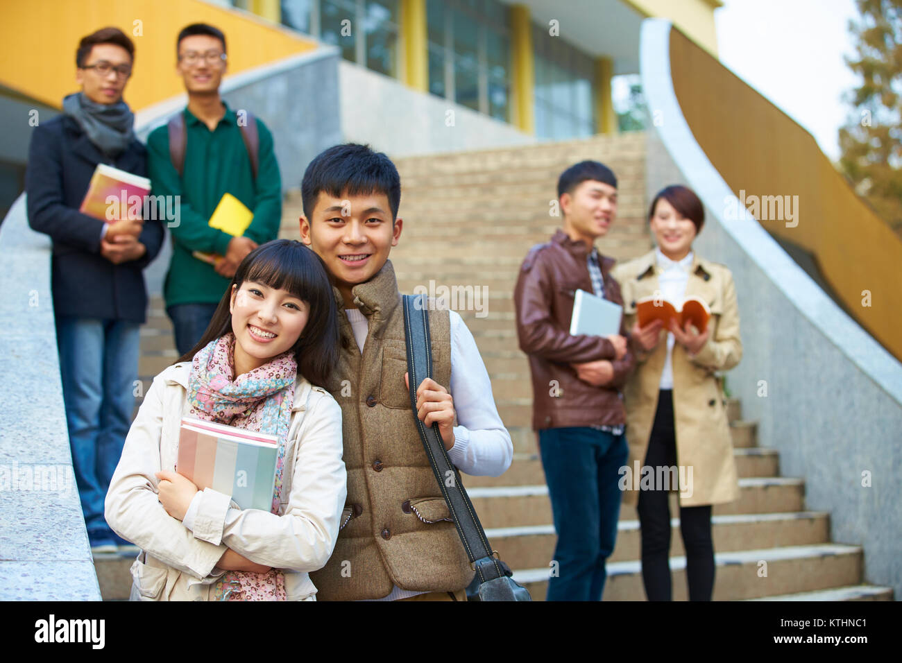 group of happy asian college students looking at camera smile in the ...