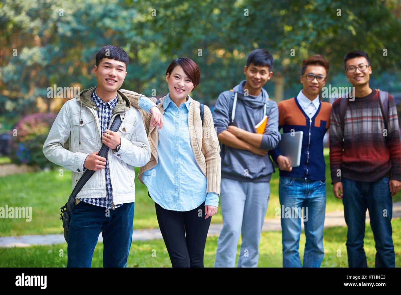 group of happy asian college students looking at camera smile in the ...