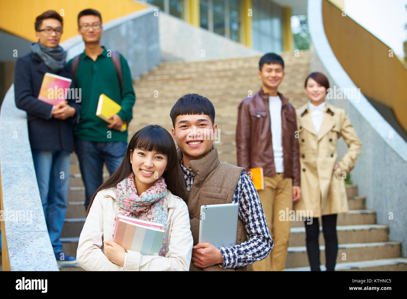 group of happy asian college students looking at camera smile in the ...