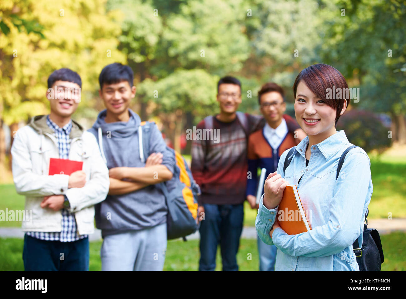 group of happy asian college students looking at camera smile in the ...