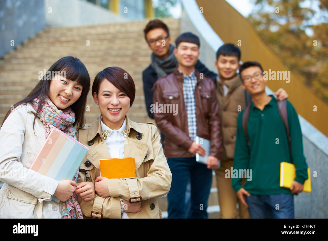 group of happy asian college students looking at camera smile in the ...