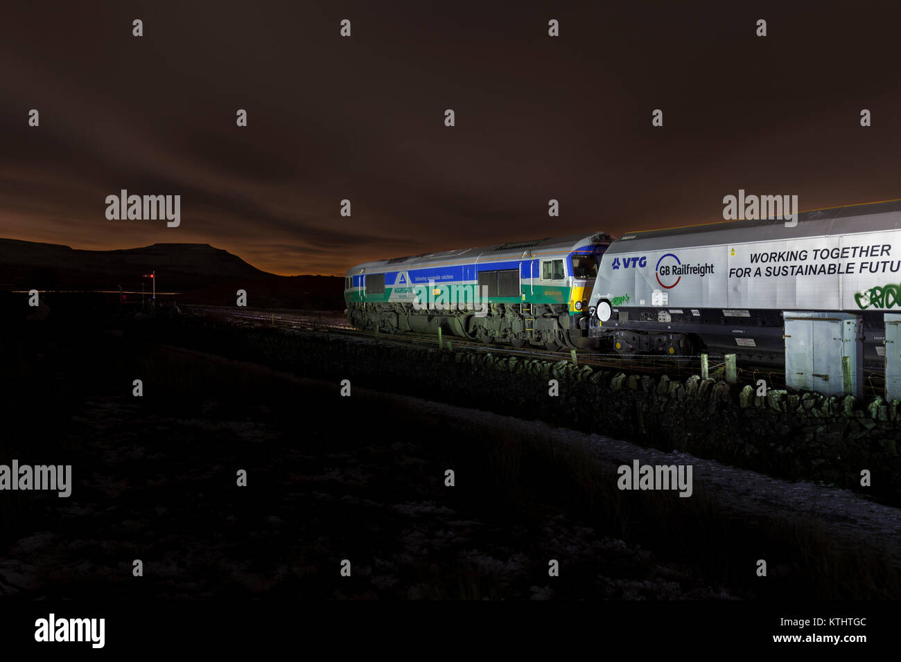 GB Railfreight class 66 locomotive at Blea Moor (north of Ribblehead)  with a Arcow Quarry - Leeds Hunslet Tarmac aggregates train Stock Photo