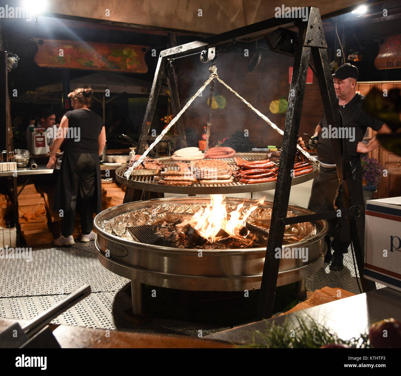 Frankfurt, Germany - August 28, 2015: People cooking meat food on a huge  grill at the Museum Embankment Festival in the city of Frankfurt, Germany  Stock Photo - Alamy
