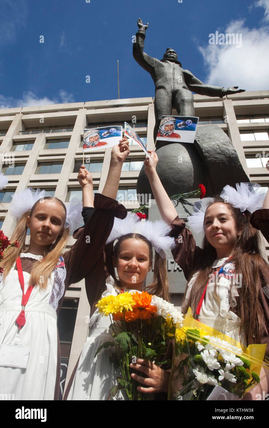 Schoolgirls from the Russian International Theatre School. A statue of Yuri Gagarin, the first man in space, was today unveiled outside the British Council's London HQ in the Mall to mark the 50th anniversary of the first manned space flight. Today, 14 July 2011, it is exactly 50 years to the day that Gagarin met the Queen as part of his visit to the UK in 1961. The unveiling of the statue was carried out by the cosmonaut's daughter Elena Gagarina, now Director fo the Kremlin Museums in Moscow Stock Photo