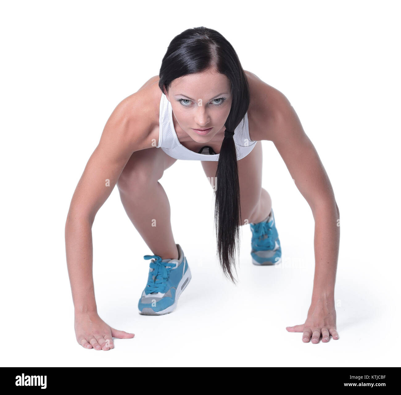 Attractive fitness woman doing low start cross fit exercises Stock Photo