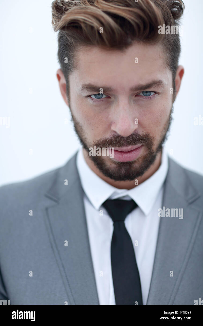Serious businessman wearing suit and tie. blue background Stock Photo ...