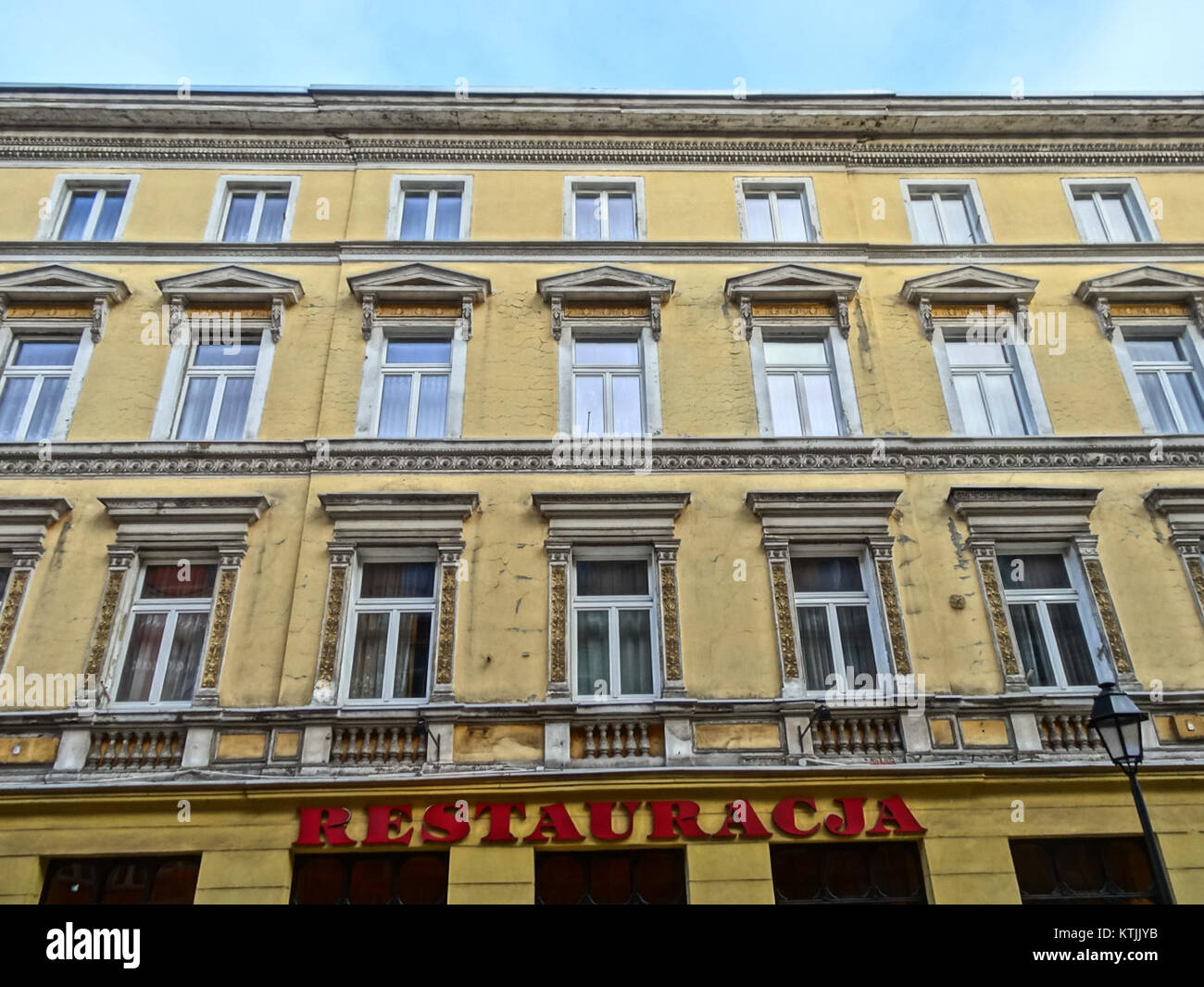 A photograph of Hotel Ratuszowy in Bydgoszcz, taken in December 2013, showing the hotel's exterior and architectural style, which blends modern and classical elements. Stock Photo