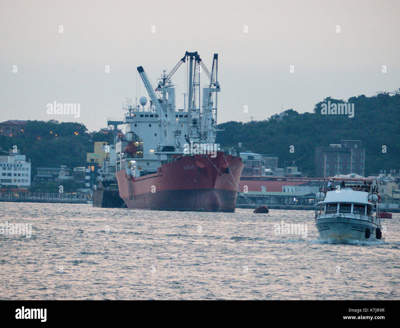 The image shows the Avatar ship in Kaohsiung Harbour alongside a cruise ...