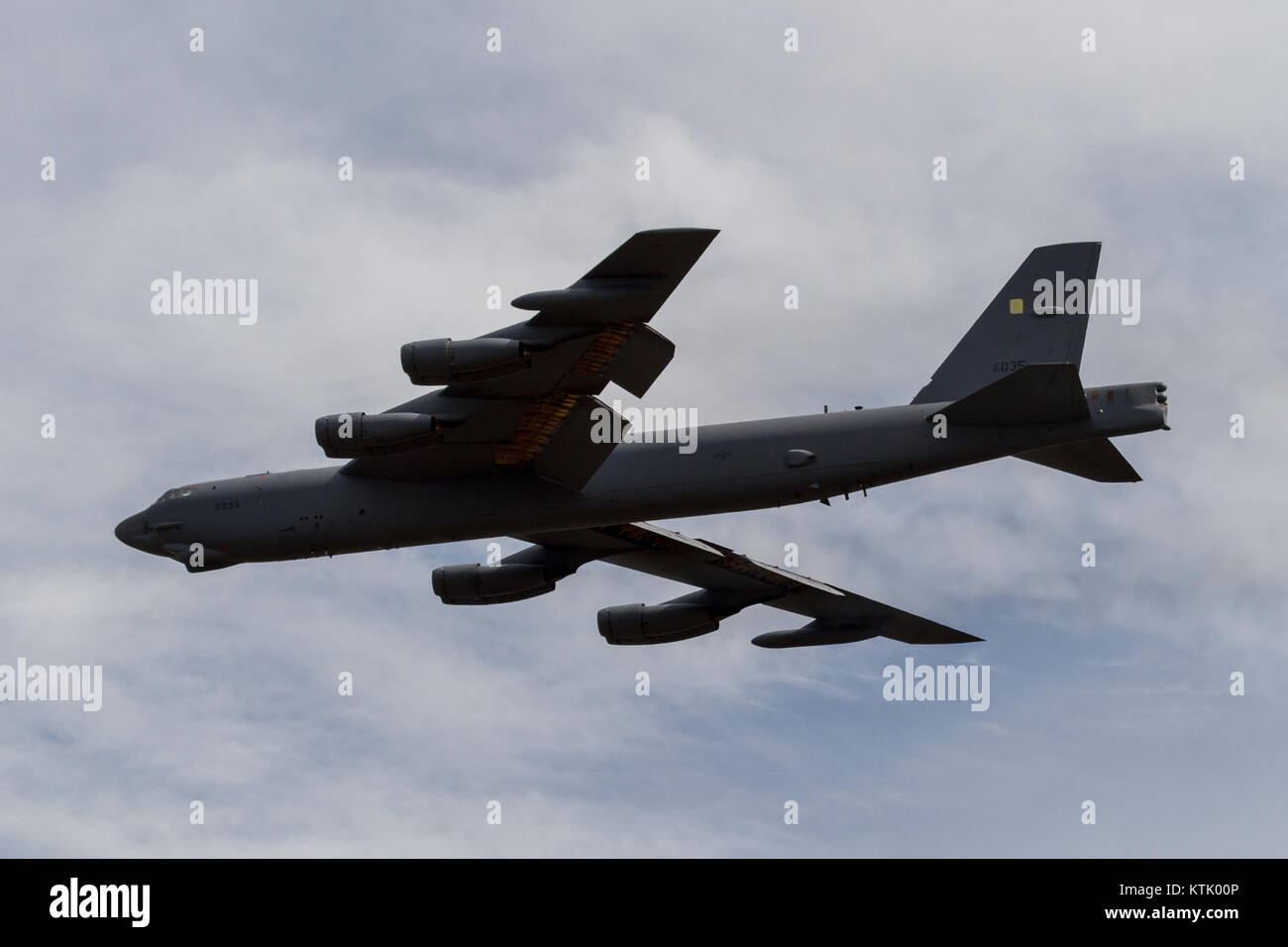 This image captures the B-52 Stratofortress taking off from Tinker Air Force Base. The B-52 is a long-range strategic bomber used by the U.S. Air Force, known for its impressive flight capabilities and role in military history. Stock Photo