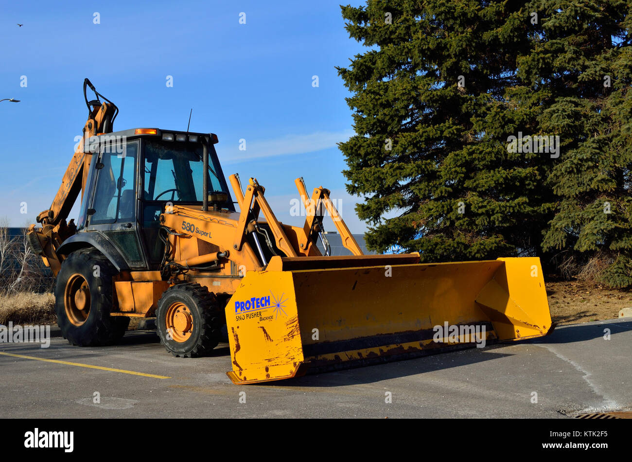 A backhoe loader is a versatile construction machine with a digging arm ...
